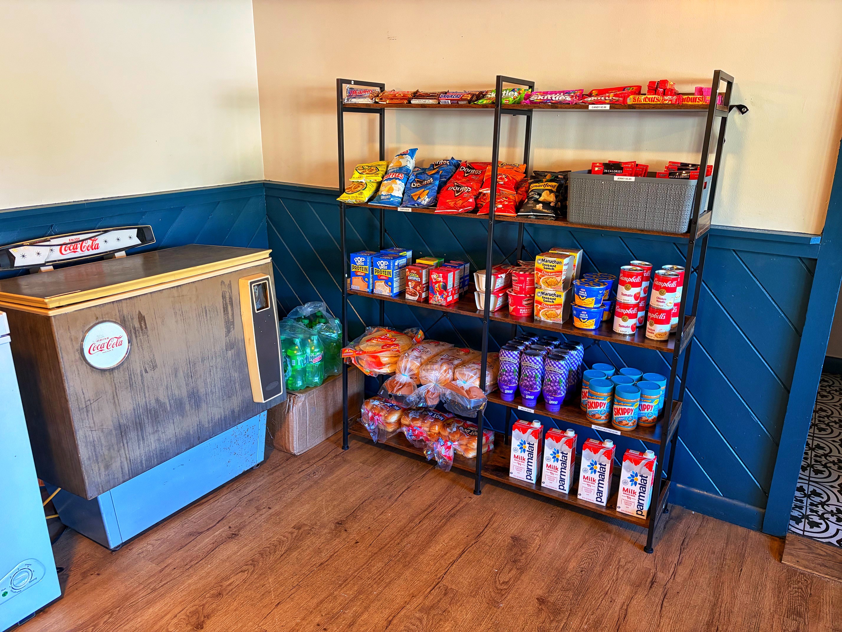 Shelves stocked with grocery basics and pantry staples
