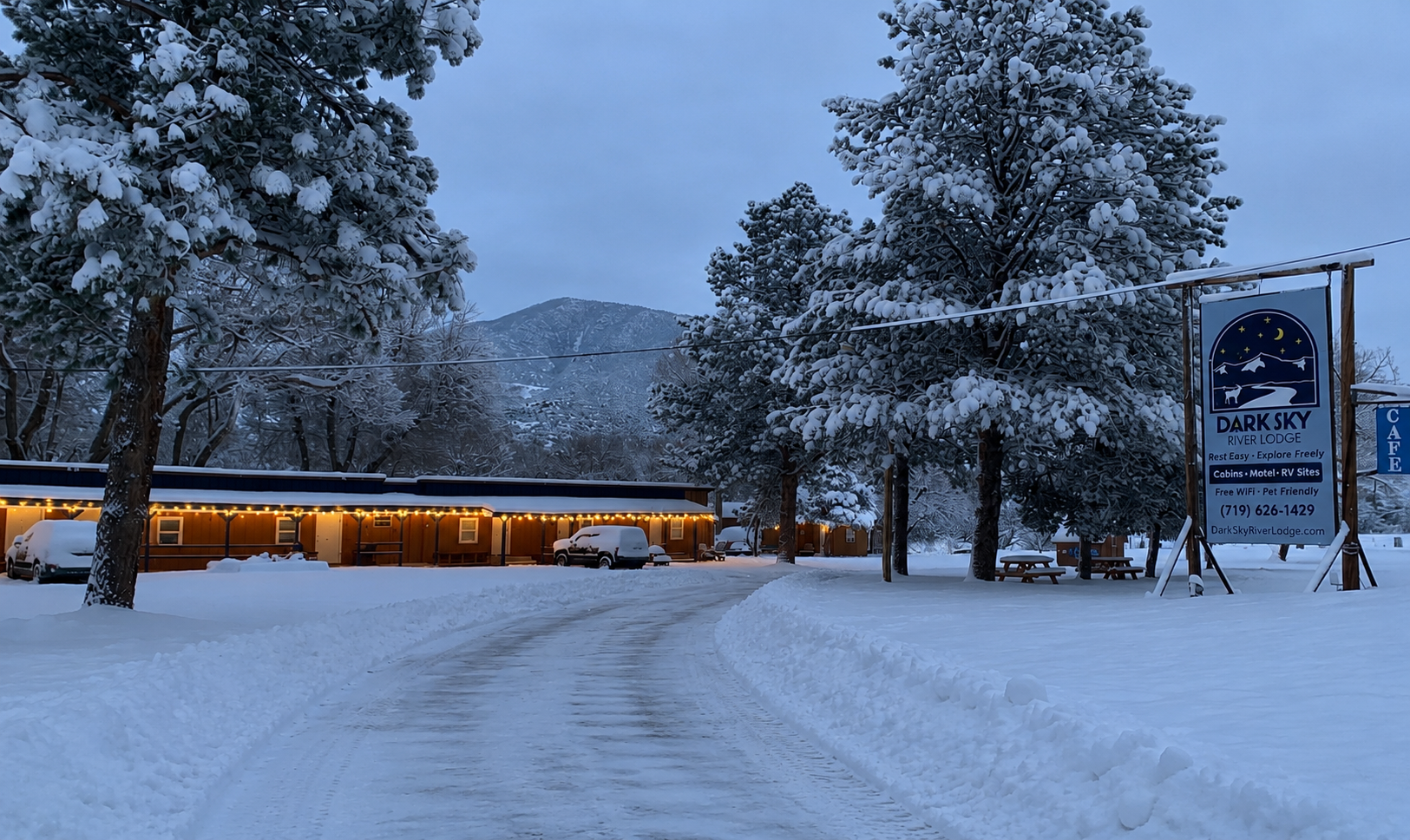 Snow-covered Dark Sky River Lodge property in winter